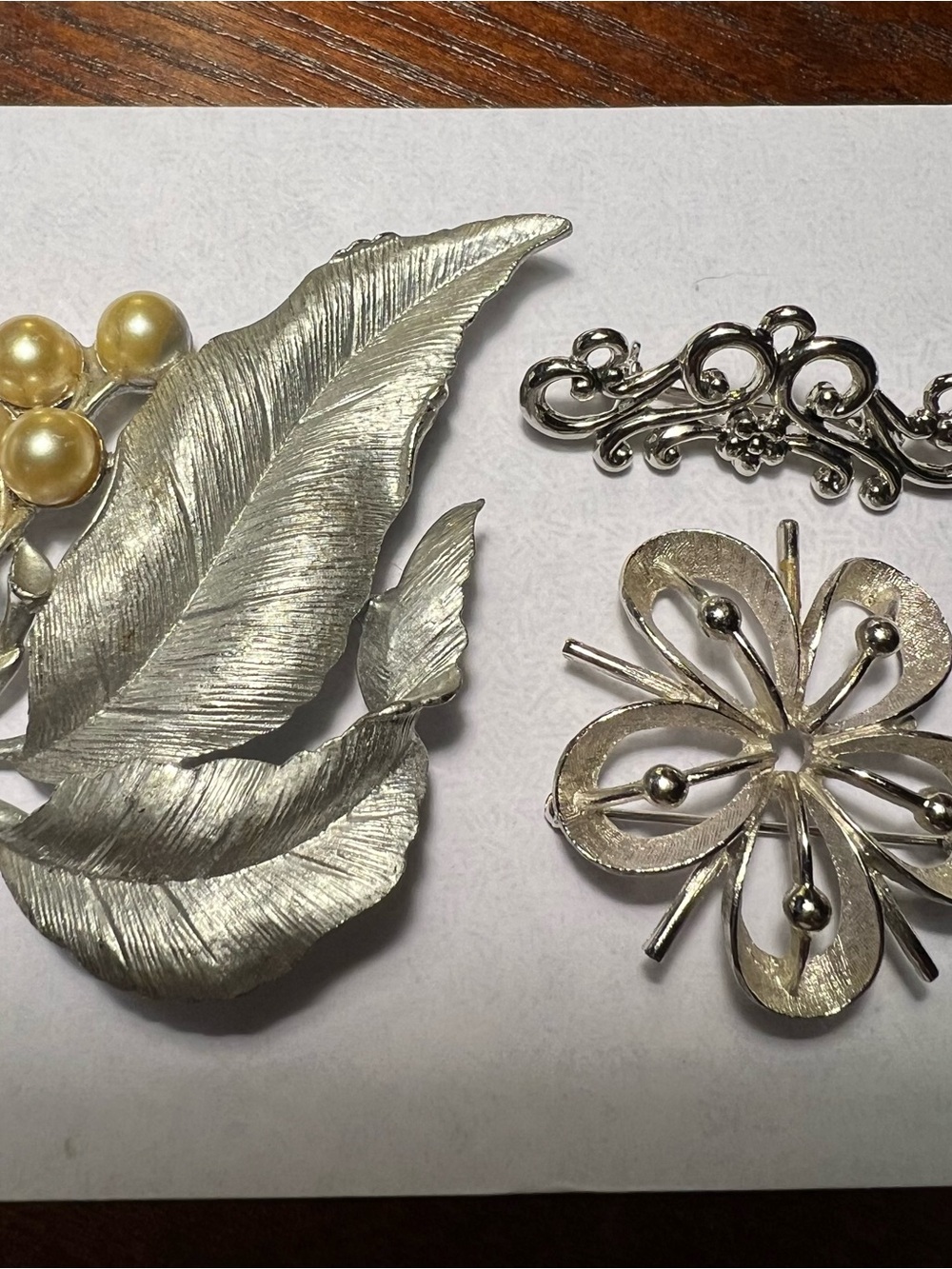 Silver-Tone Floral & Leaf Brooches
One w/faux pearls is Sarah Coventry